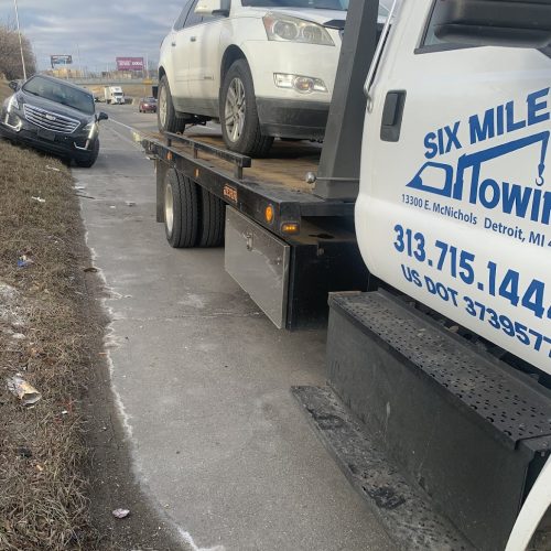 car on the back of a tow truck